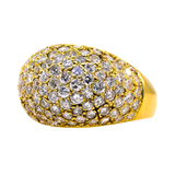 Gold ring with diamond accents on a white background