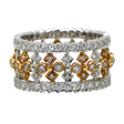 Two diamond-studded rings with gold and silver bands on a white background