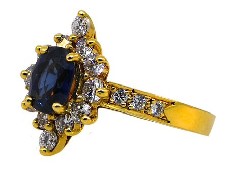 Gold ring with a blue gemstone and diamonds on a white background