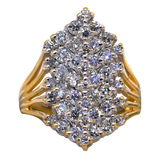 Gold ring with a cluster of diamonds on a white background