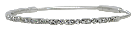 Silver bangle with small diamonds on a white background