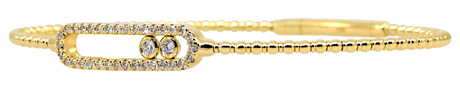 Gold bracelet with diamond accents on a white background